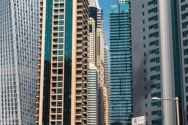 Dubai after midnight, warm breeze moving between towers and black water