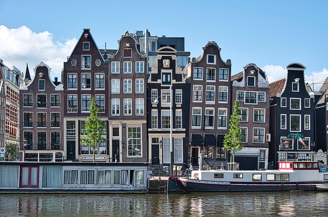 Dutch canal country at bicycle speed, water and brick carrying a steady calm