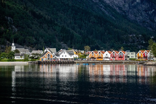 Norway in fjord country where pale light hangs long over unmoving water